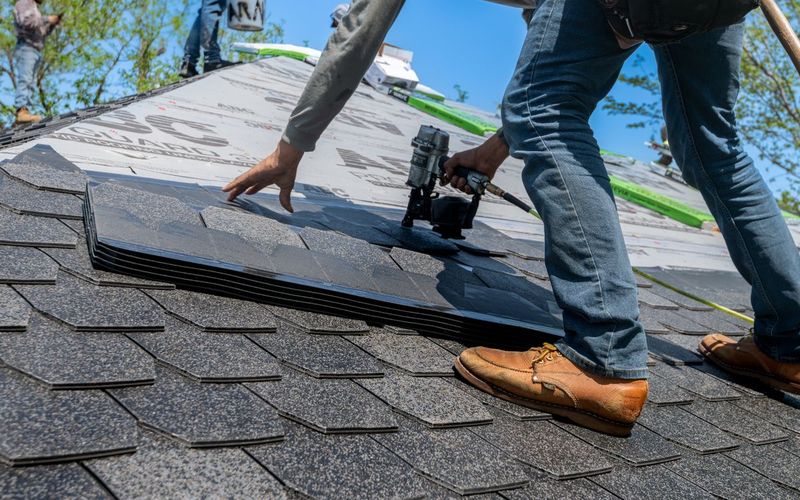 Architectural shingles being installed on a roof